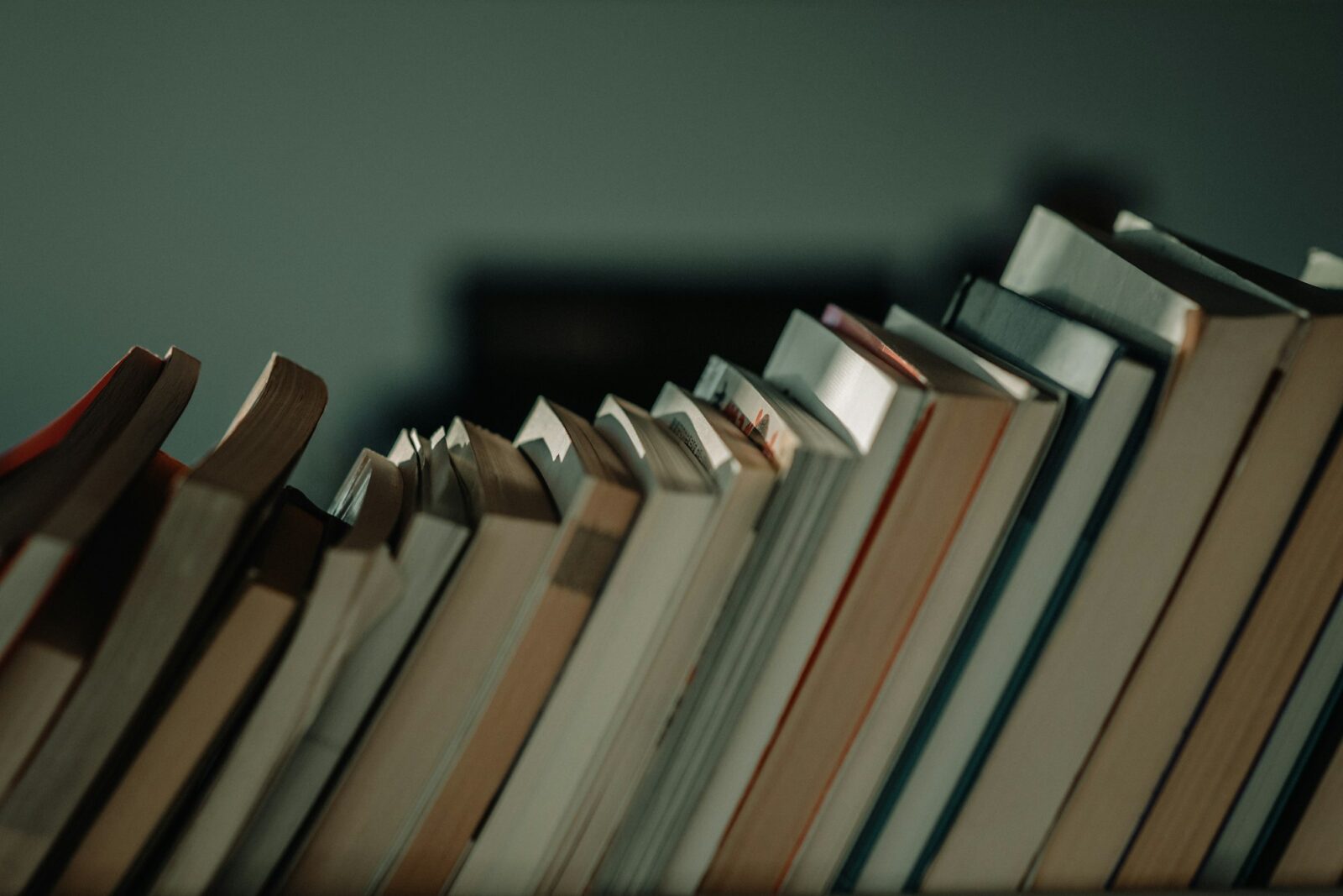 Assorted books piled together