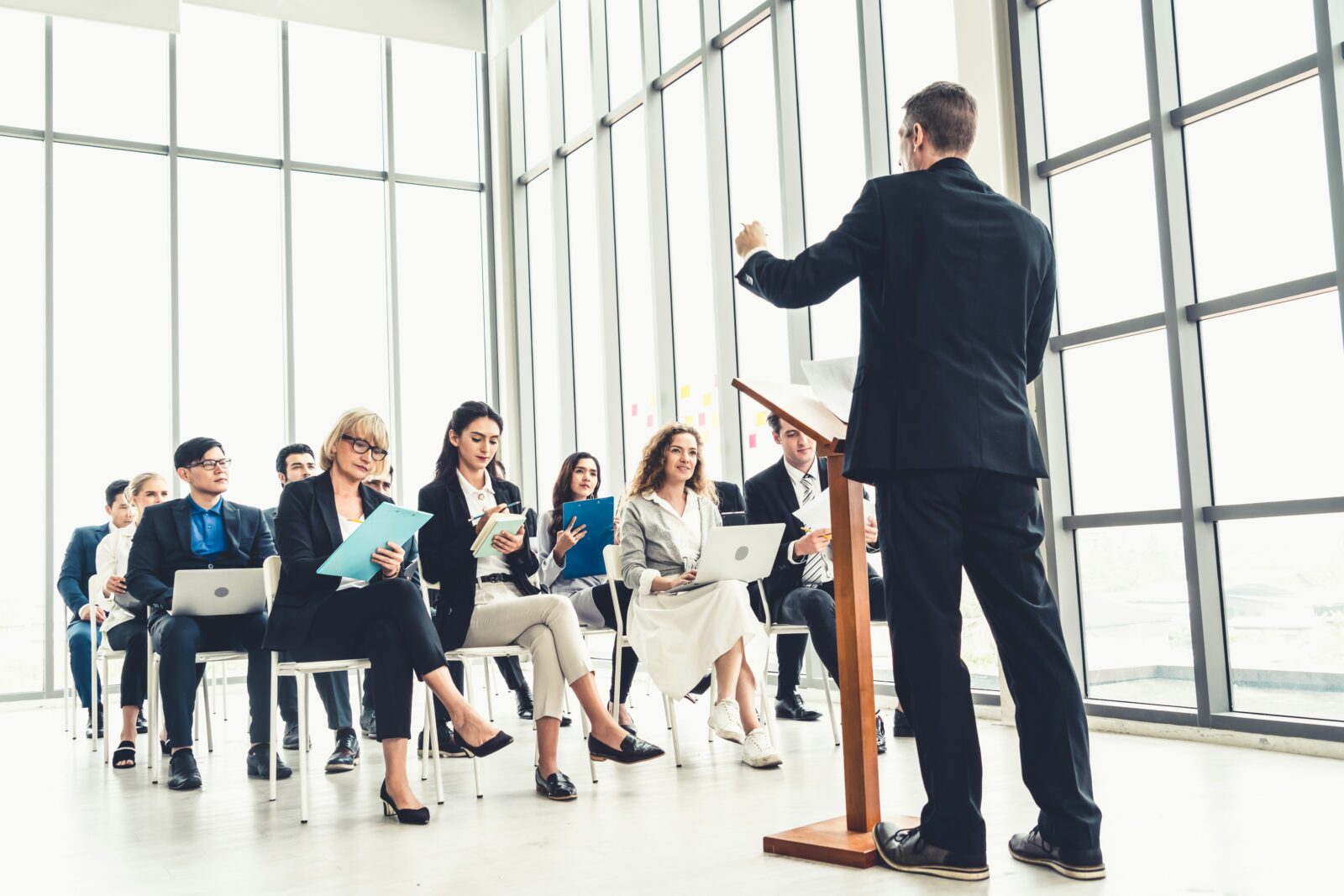 Delhi Skill and Entrepreneurship University to Initiate its Opening Session from 2021 A man in a suit presenting to a group of people in a conference room