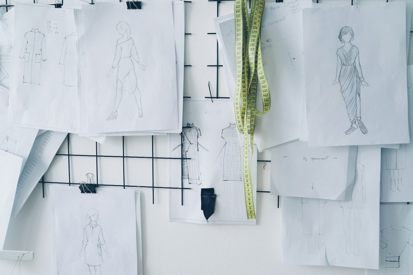 NIFT raises its fees; HC rejects the students' plea against the hike Clothing design sketches pinned to a grid board in a fashion studio