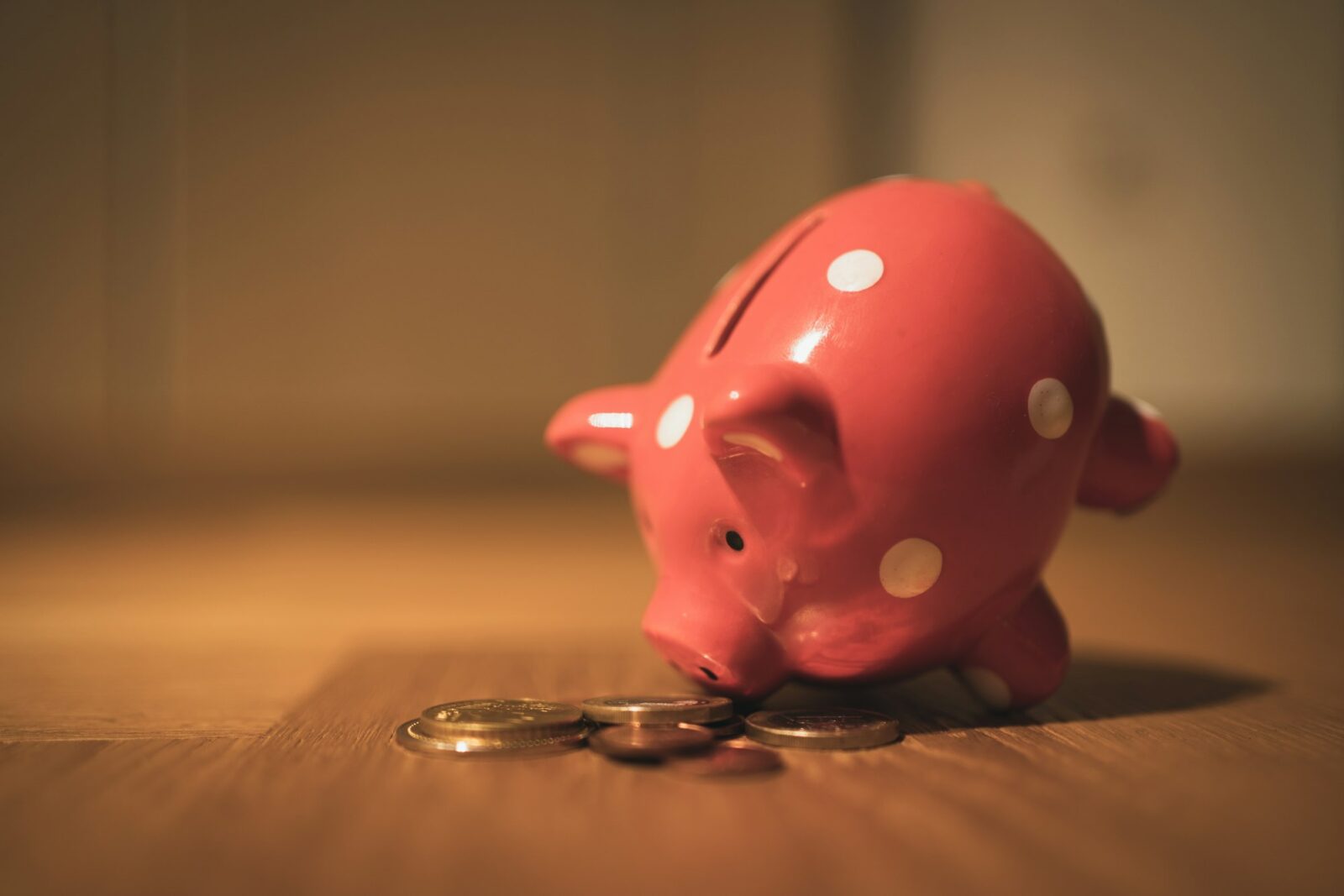 St.Stephen’s College decides to offer financial assistance to its students, sets up Resilience Fund A pink piggy bank with coins on a brown wooden table