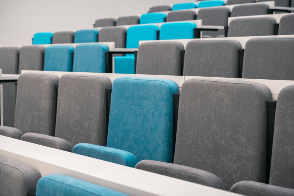 BITS Pilani introduces BITS School of Management Tiered rows of grey and blue seats in a lecture theatre