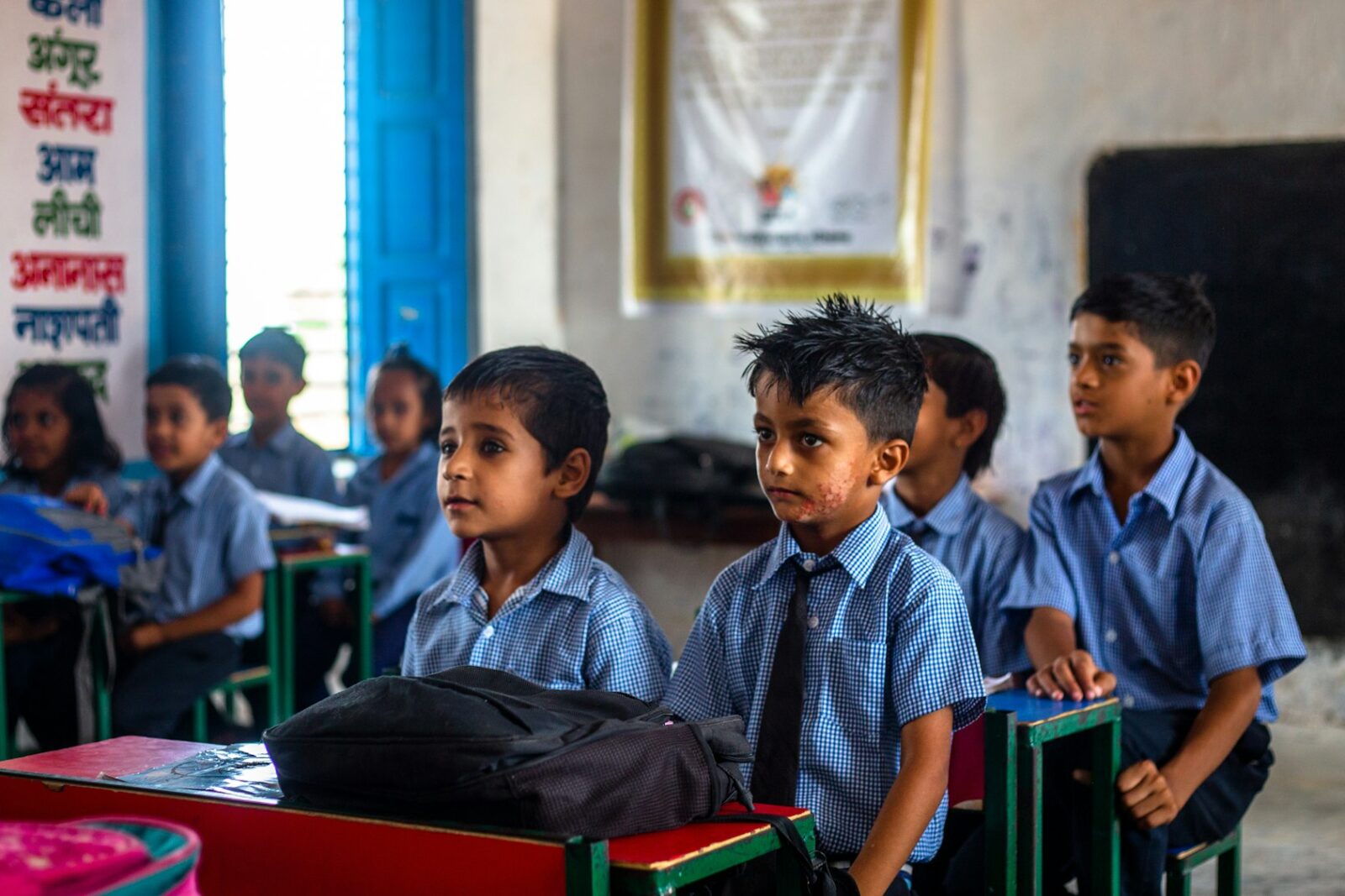 Equality In Indian Education System A group of young children sitting at desks in a classroom