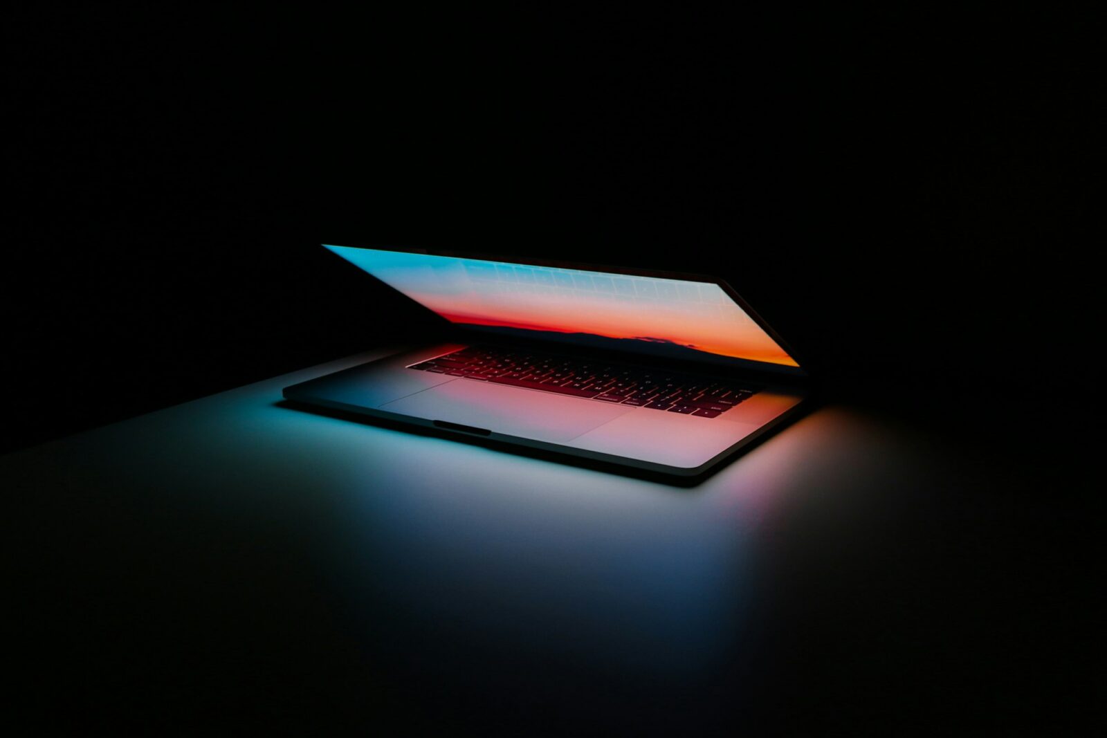 NIT Warangal’s Initiative On Learning AI An open laptop with a glowing screen on a dark surface