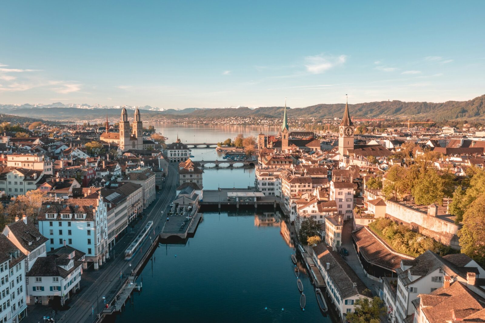 Morning view of Zurich with the Limmat river running through the old town towards the lake and Alps