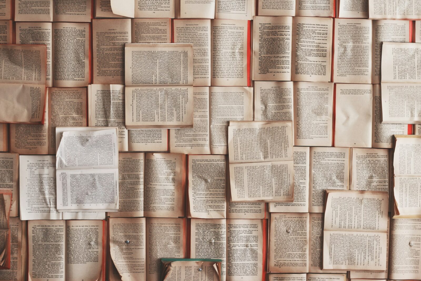 5 book recommendations by Oprah Winfrey: A pile of open books with their pages fanned out