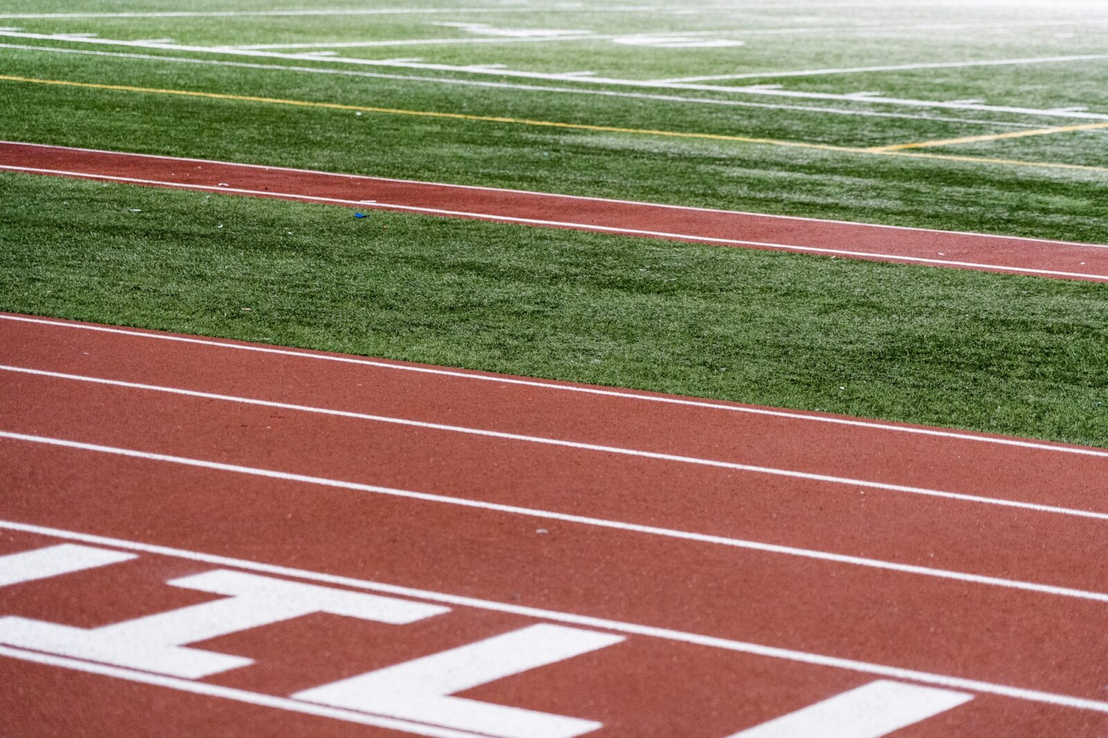 5 Reasons Why Physical Education should be encouraged in schools Close-up of a green and brown school sports field