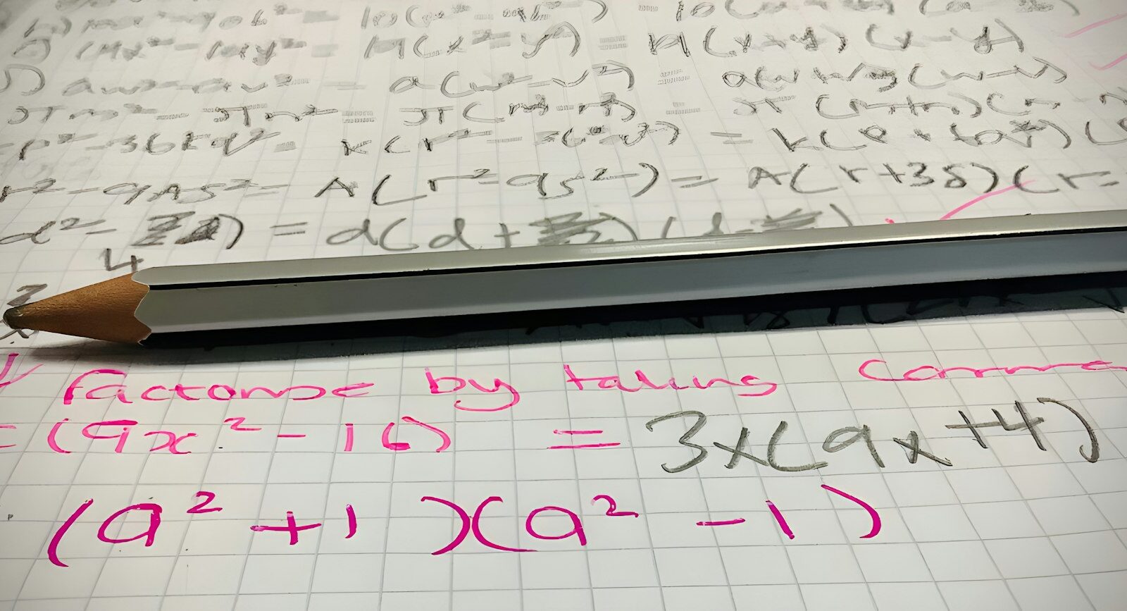 Pencil resting on a sheet of maths homework