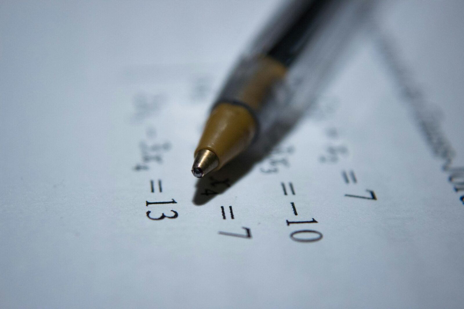 The Pandemic's Hardest-Hit Subject: Math: How 1 School Is Surpassing The Odds Pen resting on a sheet of paper covered in handwritten maths equations