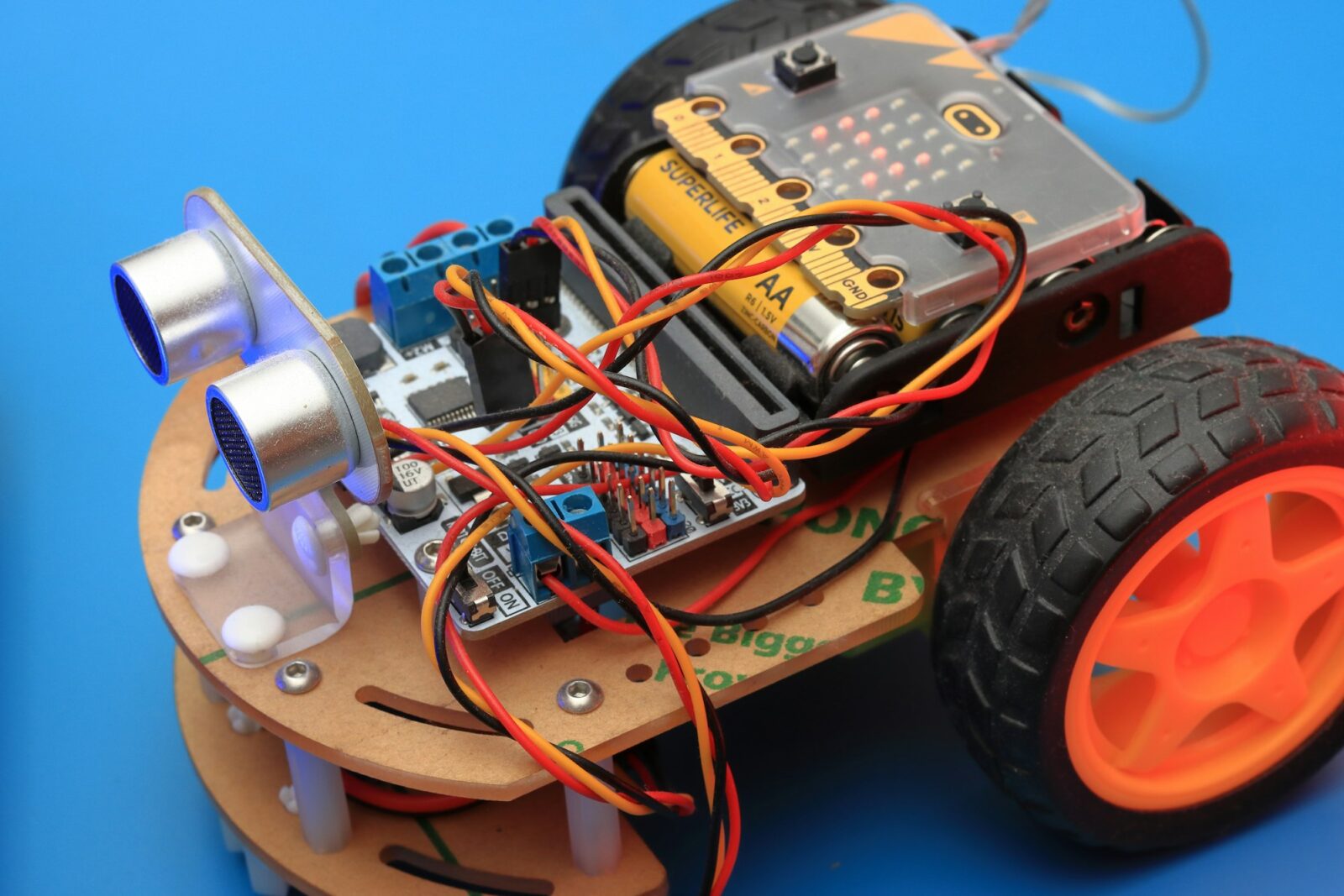 Gamification as a means of attracting more students to STEM Small robot car with wheels and wires built during a school robotics class