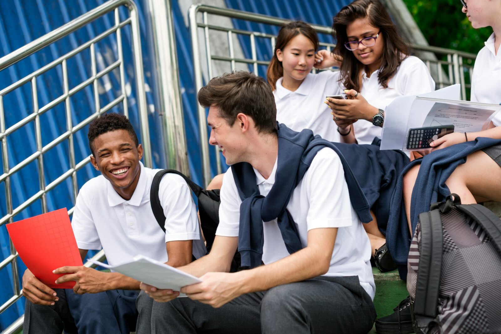 The Role of EdTech in Closing the Achievement Gap: Addressing Equity in Education Group of cheerful young students from different backgrounds gathered together