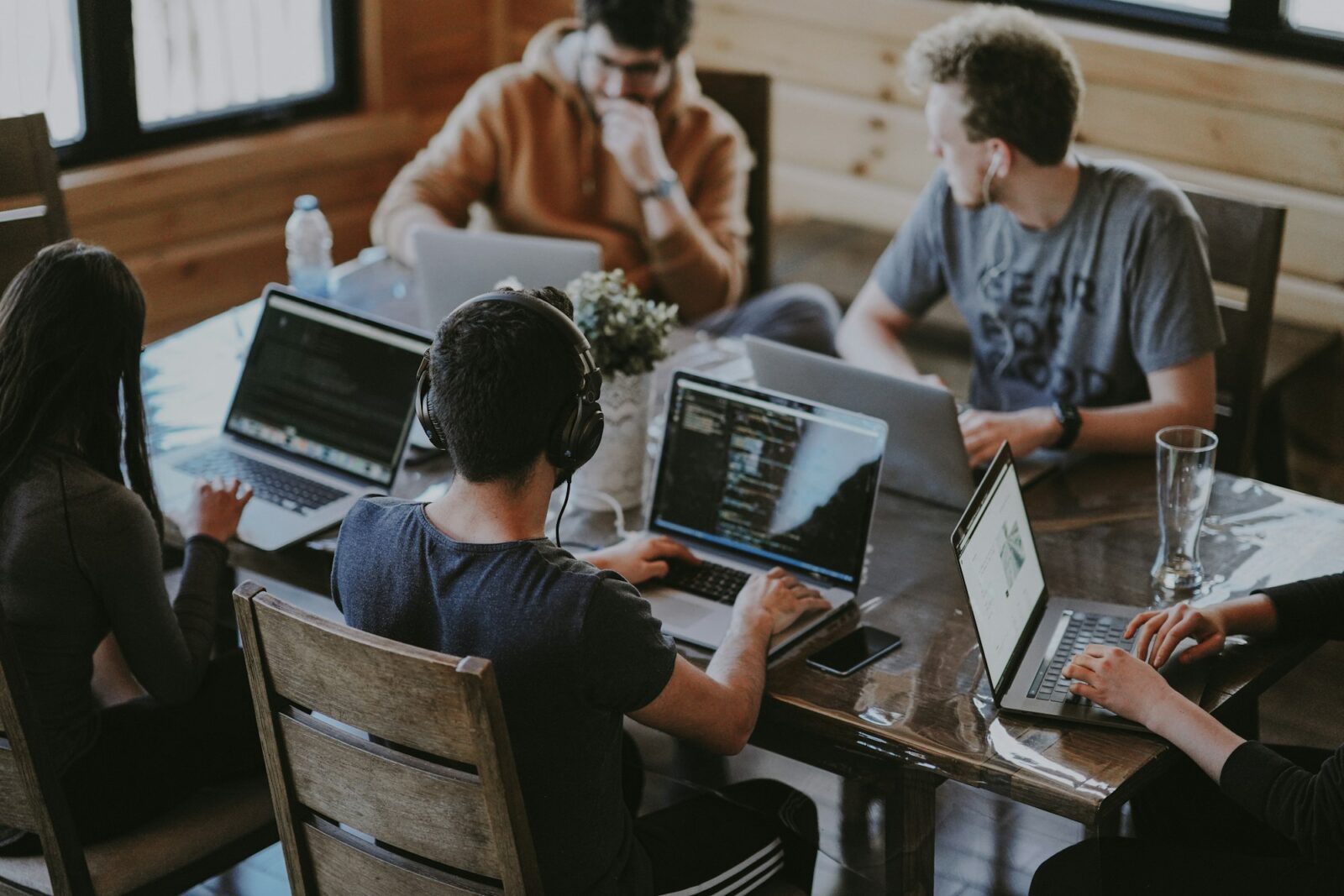 How to build a successful edtech startup: tips and lessons learned from industry experts Group of colleagues working together around a laptop