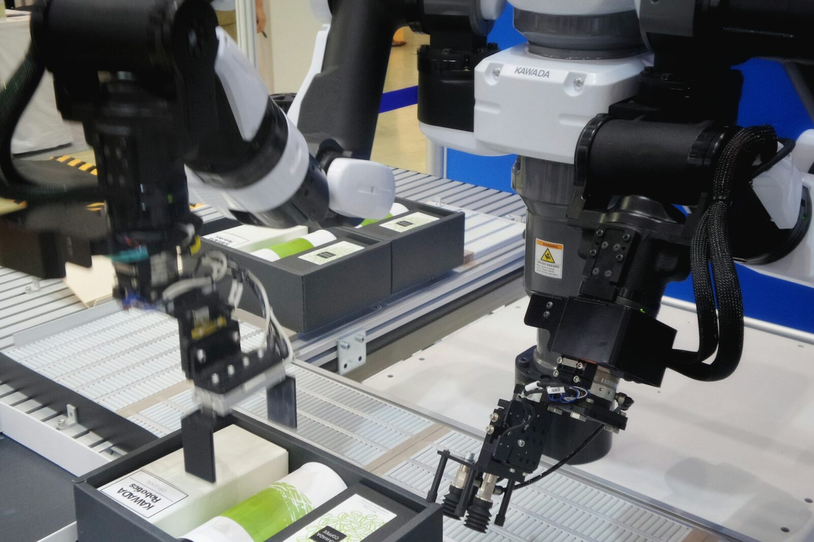The Revolutionary Grasping Innovations Black and white photograph of an industrial robotic arm