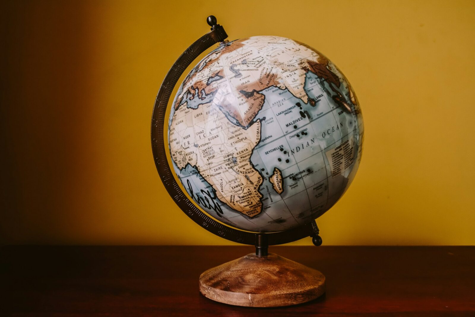 US Higher Education Abroad Sees Remarkable Growth: Open Doors 2023 Report A white and brown desk globe in soft light