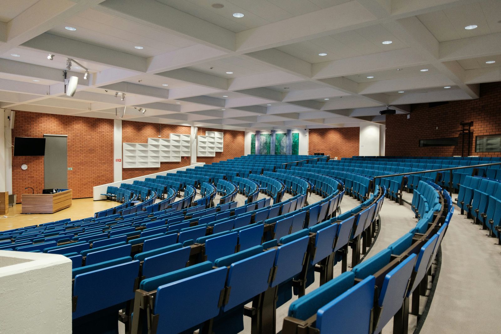 NMC opens 2027-28 medical college applications with tougher entry rules Empty tiered lecture theatre with rows of blue seats