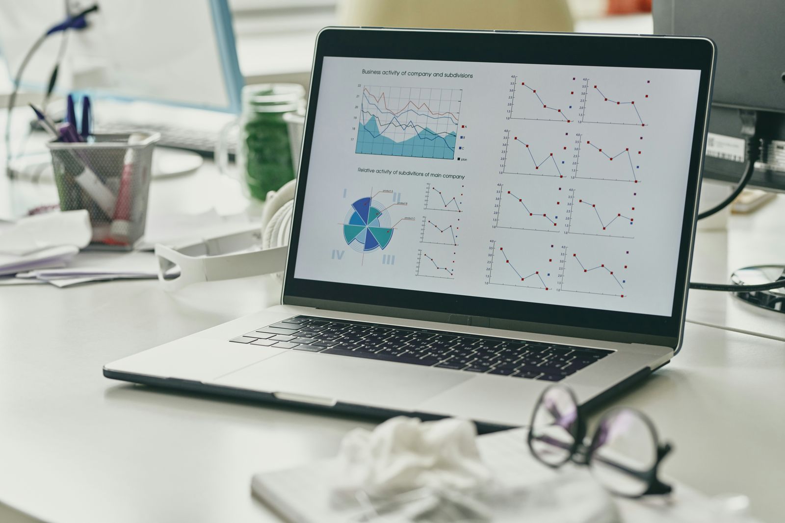 Pearson agrees to buy AI skills assessment company Workera Laptop on an office desk showing charts and graphs
